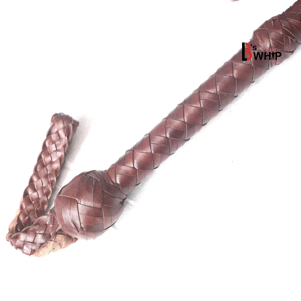 Close view of the bullwhip’s handle with a 9-inch steel core, wrapped in dark brown kangaroo leather braid for a firm grip.